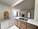 Open floor plan featuring kitchen island with double sink overlooking the living room at 6845 W Caron Dr, Peoria, AZ 85345