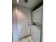 Laundry room featuring white stacked washer and dryer set and tile floor at 6845 W Caron Dr, Peoria, AZ 85345