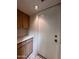 Laundry room with tile floors, upper and lower cabinets with white countertop at 6845 W Caron Dr, Peoria, AZ 85345
