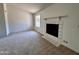 Bright room with a fireplace, neutral carpet, and natural light at 6845 W Caron Dr, Peoria, AZ 85345