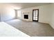 Inviting living area with a cozy fireplace and a door leading to the outdoors at 6845 W Caron Dr, Peoria, AZ 85345