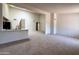 Bright living space featuring neutral carpet, natural light, and an open floor plan at 6845 W Caron Dr, Peoria, AZ 85345