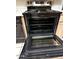 Oven with visible rack, black interior, and stainless-steel exterior at 6845 W Caron Dr, Peoria, AZ 85345