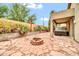 Charming backyard with covered hot tub, lush plants, and a stone-paved patio area at 7425 N 75Th Dr, Glendale, AZ 85303