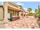 Charming backyard with covered hot tub and a stone-paved patio area at 7425 N 75Th Dr, Glendale, AZ 85303