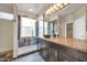 Remodeled bathroom with modern finishes and a walk-in shower with glass enclosure at 7425 N 75Th Dr, Glendale, AZ 85303