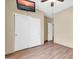 Bedroom with hardwood floors, ceiling fan and a mounted TV at 7425 N 75Th Dr, Glendale, AZ 85303