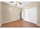 Comfortable bedroom with wood flooring, a ceiling fan, and closet space for storage at 7425 N 75Th Dr, Glendale, AZ 85303