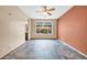 Bedroom with tile floors, ceiling fan, neutral walls, and large window providing backyard views at 7425 N 75Th Dr, Glendale, AZ 85303