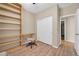 Comfortable bedroom with wood floors, closet space and a built-in desk area at 7425 N 75Th Dr, Glendale, AZ 85303