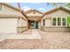 Close up shot of the front entrance featuring an inviting front entrance and stone landscaping at 7425 N 75Th Dr, Glendale, AZ 85303