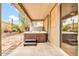 Covered patio with a relaxing hot tub, with easy access via sliding glass door at 7425 N 75Th Dr, Glendale, AZ 85303