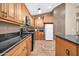 Bright kitchen with black appliances, granite countertops and custom wood cabinets at 7425 N 75Th Dr, Glendale, AZ 85303