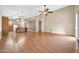 Bright and airy living area with wood laminate flooring that opens to kitchen and dining at 7425 N 75Th Dr, Glendale, AZ 85303