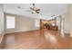 Spacious living area with wood laminate flooring that opens into the kitchen area at 7425 N 75Th Dr, Glendale, AZ 85303
