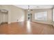 Open living room featuring wood floors, a ceiling fan, and sliding glass doors at 7425 N 75Th Dr, Glendale, AZ 85303