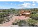 Desert estate with a three-car garage, and sprawling desert landscape at 7728 E Mary Sharon Dr, Scottsdale, AZ 85266