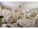 Bedroom featuring a floral design, mirrored closet and natural light at 7728 E Mary Sharon Dr, Scottsdale, AZ 85266