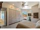 Cozy bedroom with slider door access to outdoor pool area and a large closet at 7728 E Mary Sharon Dr, Scottsdale, AZ 85266