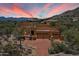 Stunning exterior elevation showing the desert landscaping and 3 car garage at 7728 E Mary Sharon Dr, Scottsdale, AZ 85266