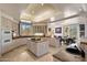 Spacious kitchen with granite countertops, a kitchen island, and views into the dining area at 7728 E Mary Sharon Dr, Scottsdale, AZ 85266