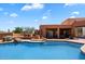 Inviting pool with an attached patio and lounge area, perfect for outdoor entertaining and relaxation at 7728 E Mary Sharon Dr, Scottsdale, AZ 85266