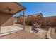 View of the patio and backyard featuring low maintenance landscaping, and an outdoor seating area at 8802 E University Dr # 28, Mesa, AZ 85207