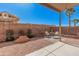 Relaxing backyard featuring low maintenance landscaping, a cozy seating area, and palm trees at 8802 E University Dr # 28, Mesa, AZ 85207