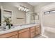 Bathroom featuring a double sink vanity and a large mirror at 8802 E University Dr # 28, Mesa, AZ 85207