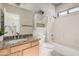 Bathroom featuring a granite countertop, bathtub, shower, and stylish decor at 8802 E University Dr # 28, Mesa, AZ 85207