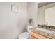 Half bathroom with granite countertop, stylish fixtures, and decorative accents for guests at 8802 E University Dr # 28, Mesa, AZ 85207