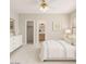 Calming bedroom with white and gold accents, ensuite bathroom, and walk-in closet for comfort and convenience at 8802 E University Dr # 28, Mesa, AZ 85207