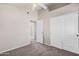 Bedroom featuring neutral paint and carpet with access to another room at 8802 E University Dr # 28, Mesa, AZ 85207