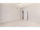 Spacious bedroom with tile flooring, ceiling fan, and ensuite bathroom and walk-in closet at 8802 E University Dr # 28, Mesa, AZ 85207