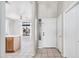Inviting entryway showcasing light tile flooring, a white front door, and an open view to the living area at 8802 E University Dr # 28, Mesa, AZ 85207