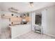 Bright kitchen area with light-toned cabinets, a stainless steel microwave, and a large window for natural light at 8802 E University Dr # 28, Mesa, AZ 85207