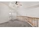 Upstairs living room featuring neutral paint and carpet with a ceiling fan at 8802 E University Dr # 28, Mesa, AZ 85207