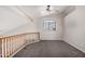 An empty upstairs living room with neutral paint, carpet, and a ceiling fan at 8802 E University Dr # 28, Mesa, AZ 85207