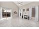 Spacious living room with tile floors, a cozy fireplace, and large windows for abundant natural light at 8802 E University Dr # 28, Mesa, AZ 85207