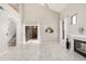 Bright living room with fireplace, vaulted ceiling, tile floor, and sliding doors to the backyard at 8802 E University Dr # 28, Mesa, AZ 85207