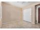 Bedroom with tile flooring, ceiling fan and closet with white sliding doors at 9135 W Hazelwood St, Phoenix, AZ 85037