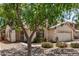 Charming home exterior with desert landscaping and a covered porch at 9135 W Hazelwood St, Phoenix, AZ 85037
