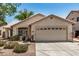 Charming home exterior with a two-car garage and low-maintenance desert landscaping at 9135 W Hazelwood St, Phoenix, AZ 85037