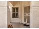 Covered front porch with a security door and charming architectural details at 9135 W Hazelwood St, Phoenix, AZ 85037