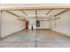 A spacious two-car garage featuring laundry hookups and plenty of room for storage or a workshop at 9135 W Hazelwood St, Phoenix, AZ 85037