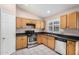 Functional kitchen with light wood cabinets and a stainless steel gas range at 9135 W Hazelwood St, Phoenix, AZ 85037