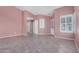 Inviting living room with tile flooring and a neutral color palette, perfect for relaxation at 9135 W Hazelwood St, Phoenix, AZ 85037