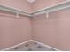 Spacious walk-in closet featuring ample storage with multiple shelves and neutral wall-color at 9135 W Hazelwood St, Phoenix, AZ 85037