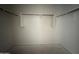 Walk-in closet offers ample storage space with shelving and rods for organized clothing and accessories at 9532 W Parkway Dr, Tolleson, AZ 85353