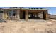 New home construction showing framing progress with wood studs, sheathing, and a partially completed roof structure at 9532 W Parkway Dr, Tolleson, AZ 85353